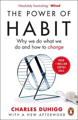 Cover of “The Power of Habit” by Charles Duhigg – red and white design with hamster wheel illustration